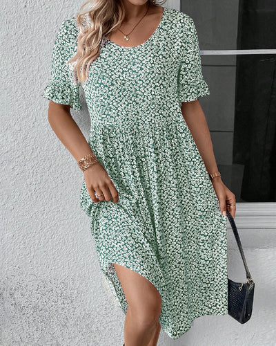 Elegantes Kleid mit Blumendruck und Rundhalsausschnitt