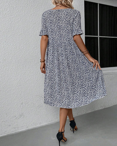 Elegantes Kleid mit Blumendruck und Rundhalsausschnitt